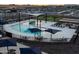 Aerial view of the community pool with lounge chairs, shade structures, and a splash pad at 3175 E Hayden Rose Ave, San Tan Valley, AZ 85143