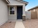 Close up of a home's front entry featuring stone accents and neutral colors at 3175 E Hayden Rose Ave, San Tan Valley, AZ 85143