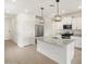 Modern kitchen with granite island, stainless steel appliances, and white cabinetry at 3175 E Hayden Rose Ave, San Tan Valley, AZ 85143