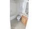 Clean bathroom with tiled floor, a shower/tub combo, and wood vanity at 6938 E Flossmoor Ave, Mesa, AZ 85208