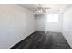 Simple bedroom with gray carpeting and a ceiling fan at 6938 E Flossmoor Ave, Mesa, AZ 85208