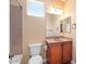 Well-lit bathroom with a vanity, a toilet, and shower and tub combo at 856 E Harmony Way, San Tan Valley, AZ 85140