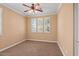 Bedroom features neutral decor, a ceiling fan, and windows with coverings for ample natural light at 856 E Harmony Way, San Tan Valley, AZ 85140