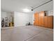 Spacious garage features built-in cabinets, utility sink, and water filtration system at 856 E Harmony Way, San Tan Valley, AZ 85140