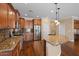 Kitchen featuring granite countertops, stainless steel appliances, and custom cabinets at 856 E Harmony Way, San Tan Valley, AZ 85140