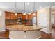 Kitchen with granite countertops, wooden cabinets and stainless steel appliances at 856 E Harmony Way, San Tan Valley, AZ 85140
