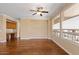 Spacious living room boasts gleaming hardwood floors and large windows offering an abundance of natural light at 856 E Harmony Way, San Tan Valley, AZ 85140