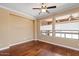 Living room with hardwood floors, neutral walls, ceiling fan, and natural light at 856 E Harmony Way, San Tan Valley, AZ 85140