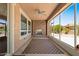 Inviting sunroom with brick fireplace, ceiling fan, and floor-to-ceiling windows at 856 E Harmony Way, San Tan Valley, AZ 85140