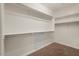 Well-organized walk-in closet offers ample storage with multiple shelves and rods at 856 E Harmony Way, San Tan Valley, AZ 85140