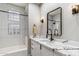 Modern bathroom with white subway tile and marble vanity at 10695 E Caribbean Ln, Scottsdale, AZ 85255