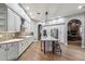 Modern kitchen with white cabinets, a large island, and stainless steel appliances at 10695 E Caribbean Ln, Scottsdale, AZ 85255