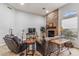 Spacious living room featuring a stone fireplace and comfortable seating at 10695 E Caribbean Ln, Scottsdale, AZ 85255