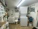 Laundry room with washer, dryer, and extra storage at 1498 W Pawnee Ave, Apache Junction, AZ 85119