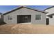 Newly built home with covered patio and large backyard at 37907 N Cowboy Ln, San Tan Valley, AZ 85140