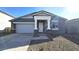 New single-story home with gray exterior and stone accents at 37907 N Cowboy Ln, San Tan Valley, AZ 85140