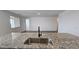 Kitchen island with granite countertops and sink at 37907 N Cowboy Ln, San Tan Valley, AZ 85140