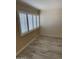 Bright bedroom with wood-look floors and plantation shutters at 4330 N 5Th Ave # 106, Phoenix, AZ 85013