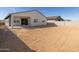 Back yard with block wall fence, covered patio, offering ample space for outdoor activities at 4922 W Hunter Trl, San Tan Valley, AZ 85144