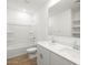 Modern bathroom featuring double sinks, a shower-tub combo, and wood-look tile flooring at 4922 W Hunter Trl, San Tan Valley, AZ 85144