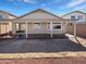 Covered patio in a private backyard offering space for outdoor entertaining and relaxation at 6556 S 258Th Dr, Buckeye, AZ 85326