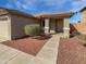 Charming single-story home with a neatly landscaped front yard and inviting entryway at 6556 S 258Th Dr, Buckeye, AZ 85326