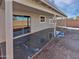 Back patio with a sliding glass door leading inside at 6556 S 258Th Dr, Buckeye, AZ 85326