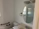 Bathroom with single sink vanity, toilet and grab bars at 10861 W Venturi Dr, Sun City, AZ 85351