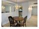 Elegant dining room with chandelier and table at 10861 W Venturi Dr, Sun City, AZ 85351