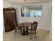 Bright dining room featuring a chandelier and classic wooden furniture at 10861 W Venturi Dr, Sun City, AZ 85351