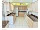 Bright kitchen with granite countertops and ample cabinet space at 10861 W Venturi Dr, Sun City, AZ 85351