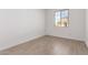 Bedroom featuring natural light, neutral walls, and tile floors at 11632 W Beck Dr, Youngtown, AZ 85363