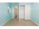 Bedroom with light teal walls and mirrored closet doors at 2741 W Pecan Rd, Phoenix, AZ 85041