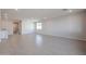 Spacious living room featuring recessed lighting, large window, and tile flooring at 39980 W Bravo Dr, Maricopa, AZ 85138