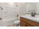 Bathroom features a new vanity, updated bronze faucet, and a shower-tub combo at 5664 N 205Th Ln, Buckeye, AZ 85396