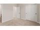 Well-lit bedroom with neutral walls, carpet, and closet with sliding doors at 5664 N 205Th Ln, Buckeye, AZ 85396