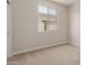 Neutral bedroom with carpet flooring and a window that brings in natural light at 5664 N 205Th Ln, Buckeye, AZ 85396