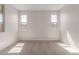 Bright bedroom boasts neutral carpet, large windows, and ample natural light at 5664 N 205Th Ln, Buckeye, AZ 85396