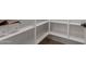 A bright pantry features many white shelves and is ready for all of your food at 5664 N 205Th Ln, Buckeye, AZ 85396