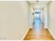 Long hallway with wood-look tile flooring at 22896 E Poco Calle --, Queen Creek, AZ 85142