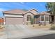 Charming single-story home with a two-car garage and well-maintained desert landscaping at 2412 W Crimson Ter, Phoenix, AZ 85085