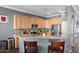 Stylish kitchen with granite countertops, stainless steel appliances, and ample cabinet space at 2412 W Crimson Ter, Phoenix, AZ 85085