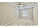 Bright bedroom with ceiling fan and carpeted floor at 746 E Doral Ave # 201, Gilbert, AZ 85297