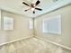 Well-lit bedroom with ceiling fan and carpet at 746 E Doral Ave # 201, Gilbert, AZ 85297