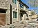 Modern townhome with stone and stucco exterior, plus a walkway at 746 E Doral Ave # 201, Gilbert, AZ 85297