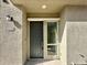 Contemporary front door with sidelight window and exterior light at 746 E Doral Ave # 201, Gilbert, AZ 85297