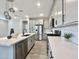 Contemporary kitchen with an island, stainless steel appliances, and white cabinets at 746 E Doral Ave # 201, Gilbert, AZ 85297
