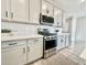Modern kitchen with stainless steel appliances and white cabinets at 746 E Doral Ave # 201, Gilbert, AZ 85297
