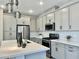 Modern kitchen with stainless steel appliances and an island at 746 E Doral Ave # 201, Gilbert, AZ 85297