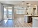 Open living area with sliding glass doors leading to a balcony at 746 E Doral Ave # 201, Gilbert, AZ 85297